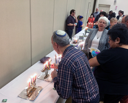 Those who brought their own menorahs lit candles too.