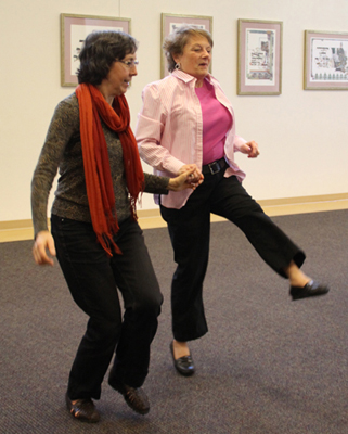 Claire Lee and Sandy Richards started dancing to the music.
