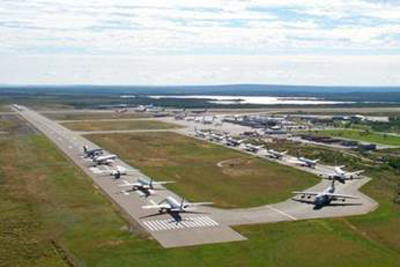 Planes lined up on an airstrip in Canada.