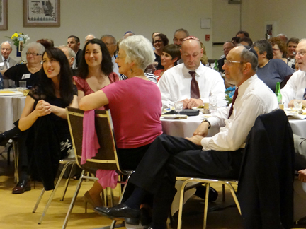 Rabbi's table enjoys the performances.