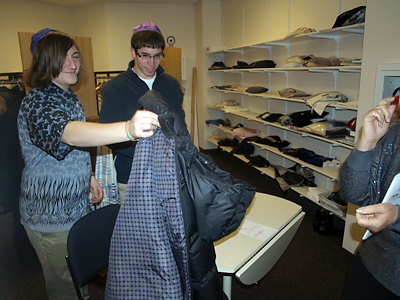 USY-ers checked coats to raise funds for USY projects.