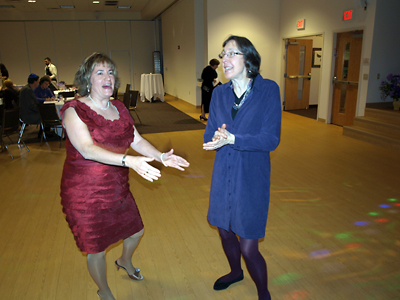 Lynn Kohel and Claire Lee dance to the music.