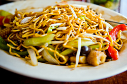 Plate filled with Chinese noodles and vegetables